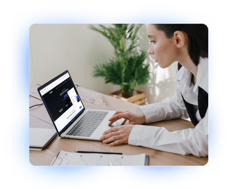 A Woman Is Using A Laptop The Convert App